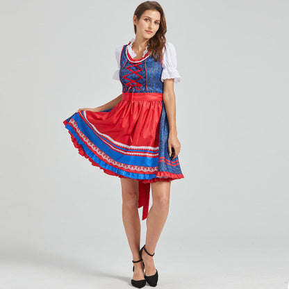 Festive dirndl with red apron and traditional details