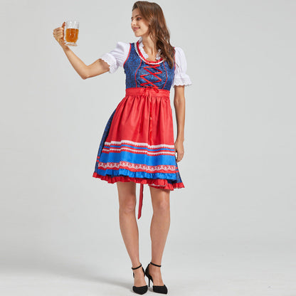 Festive dirndl with red apron and traditional details