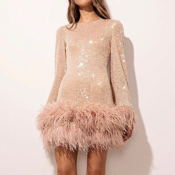Glamorous dress with sequins and feather hem
