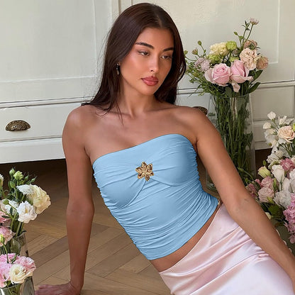 Ruffled strapless top with brooch detail