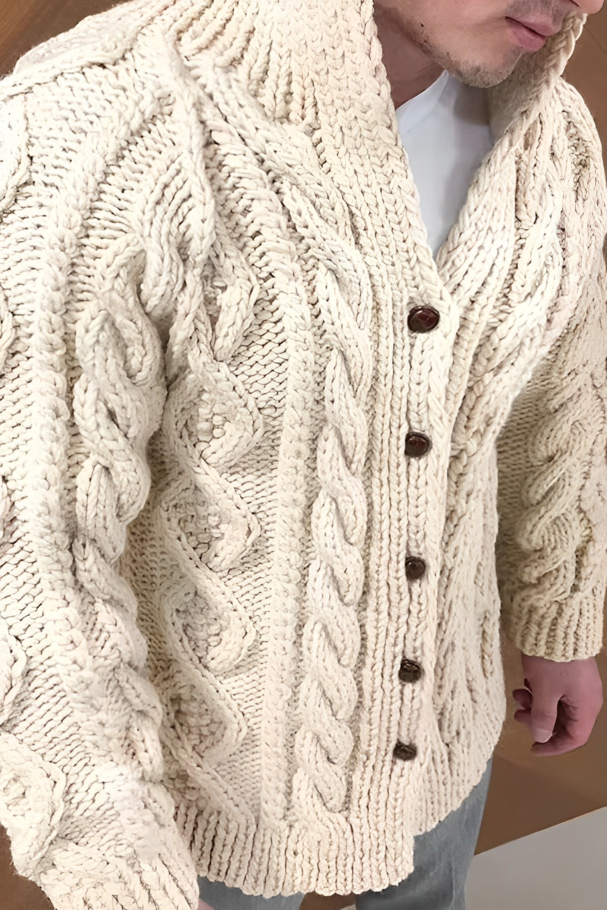 Warm knit cardigan with cable knit pattern
