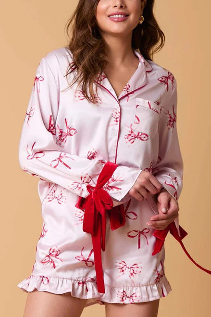 Velina Moda | Christmas Fashion Printed Bow Top and Elastic Waist Ruffle Shorts Set