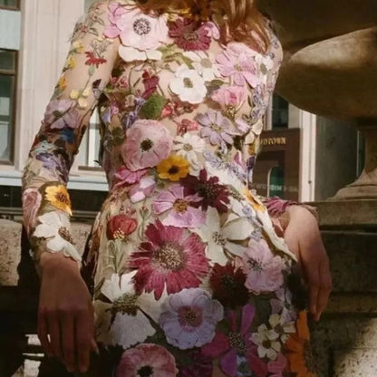 Mini dress with floral applications and translucent appearance