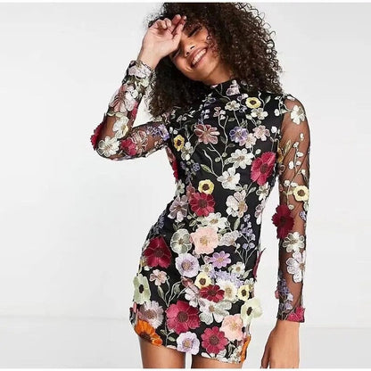 Mini dress with floral applications and translucent appearance