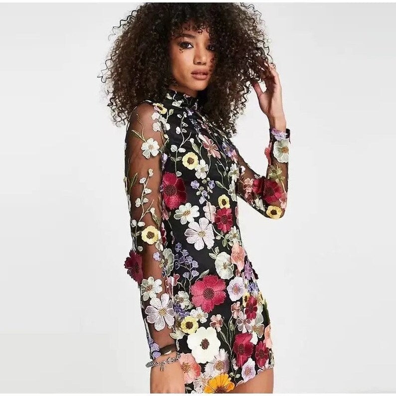 Mini dress with floral applications and translucent appearance