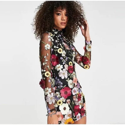 Mini dress with floral applications and translucent appearance